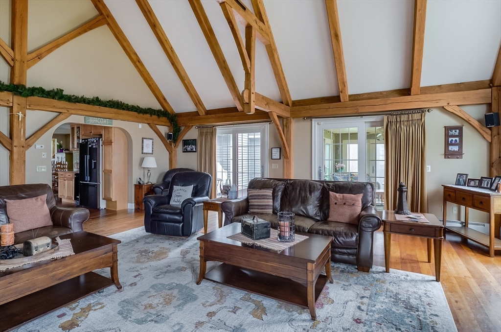 60 Emerald Road Rutland, MA 01543 - Photo 4 of 42 a living room with furniture a couch and wooden floor