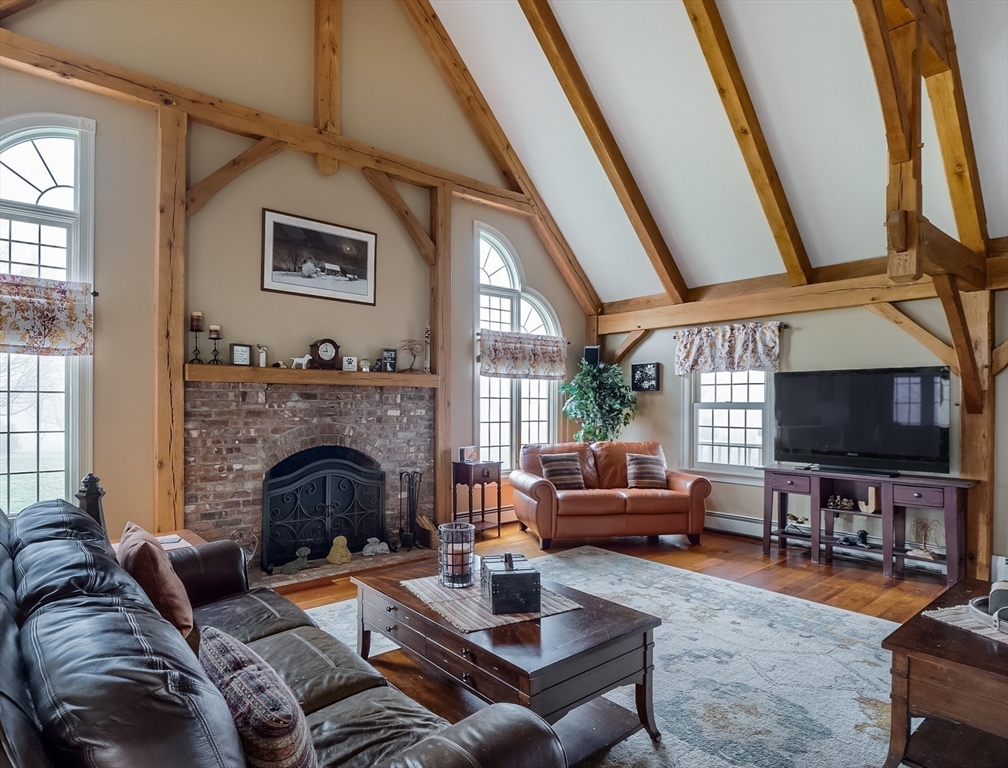 60 Emerald Road Rutland, MA 01543 - Photo 5 of 42 a living room with furniture and a fireplace