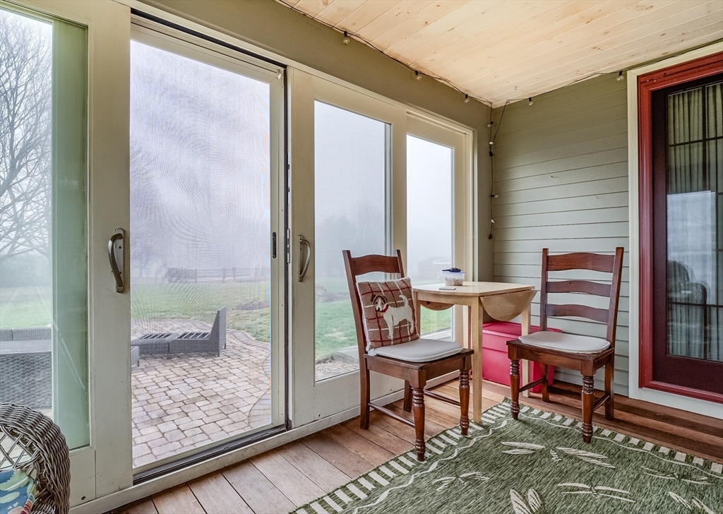 60 Emerald Road Rutland, MA 01543 - Photo 7 of 42 a balcony with table and chairs