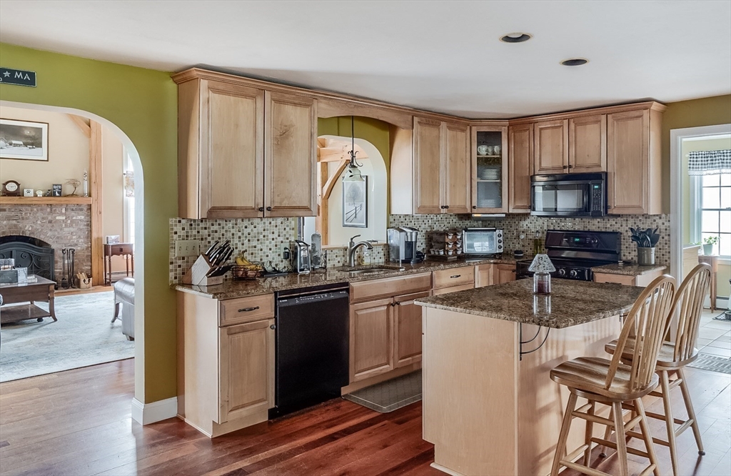 60 Emerald Road Rutland, MA 01543 - Photo 8 of 42 a kitchen with stainless steel appliances granite countertop a stove a sink a refrigerator and a microwave