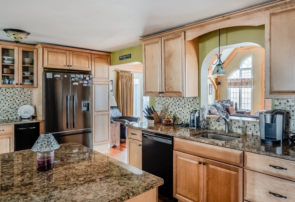60 Emerald Road Rutland, MA 01543 - Photo 9 of 42 a kitchen with a refrigerator and a sink