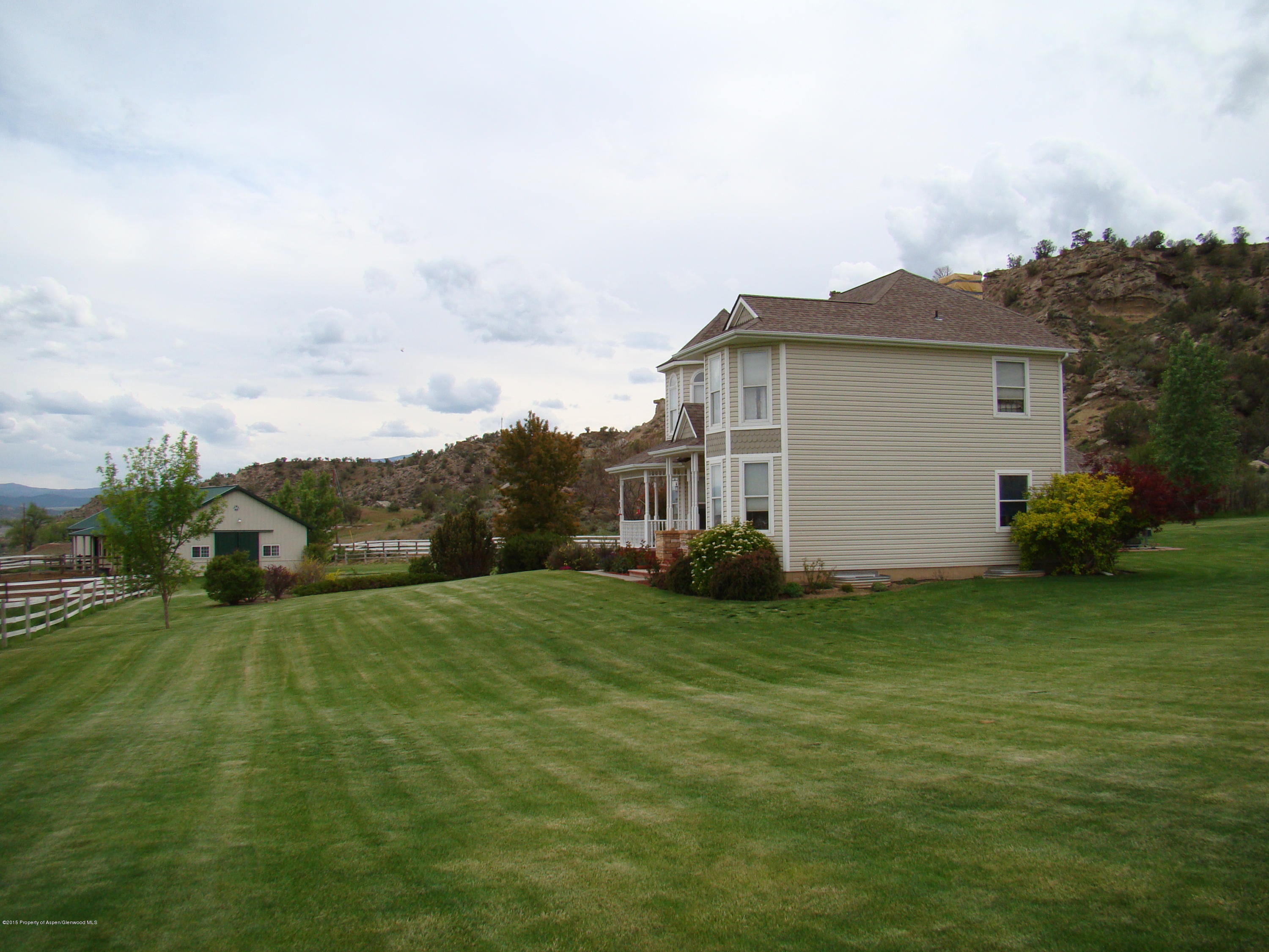 3143 County Road 233 Rifle, CO 81650 - Photo 5 of 36 a view of a house with a yard