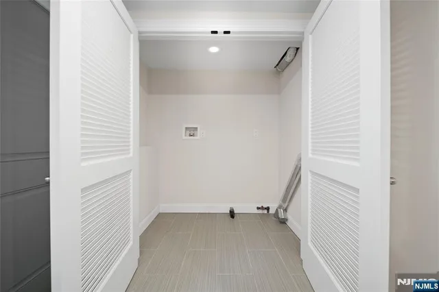 a view of a room with rack on the wall