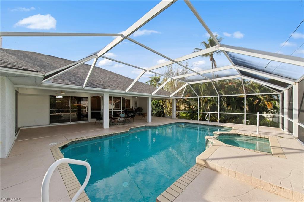 4724 Riverside Drive Estero, FL 33928 - Photo 30 of 44 a view of a house with swimming pool