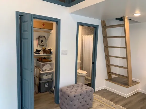 a bathroom with a toilet and a shower