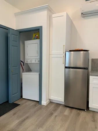 a bathroom with a toilet a sink and a mirror