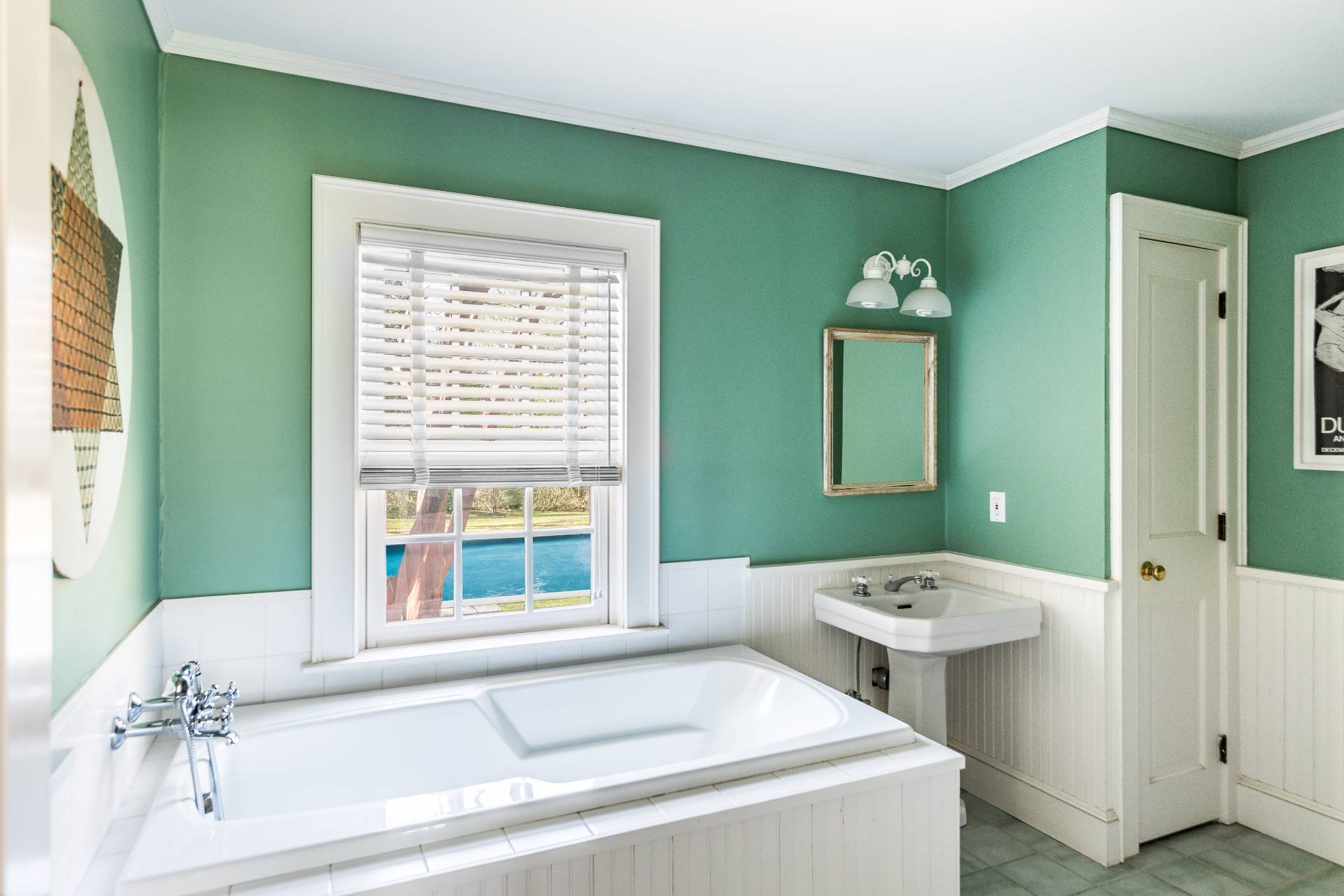 22 Barn Lane Bridgehampton, NY 11932 - Photo 13 of 18 a bathroom with a sink and a large mirror