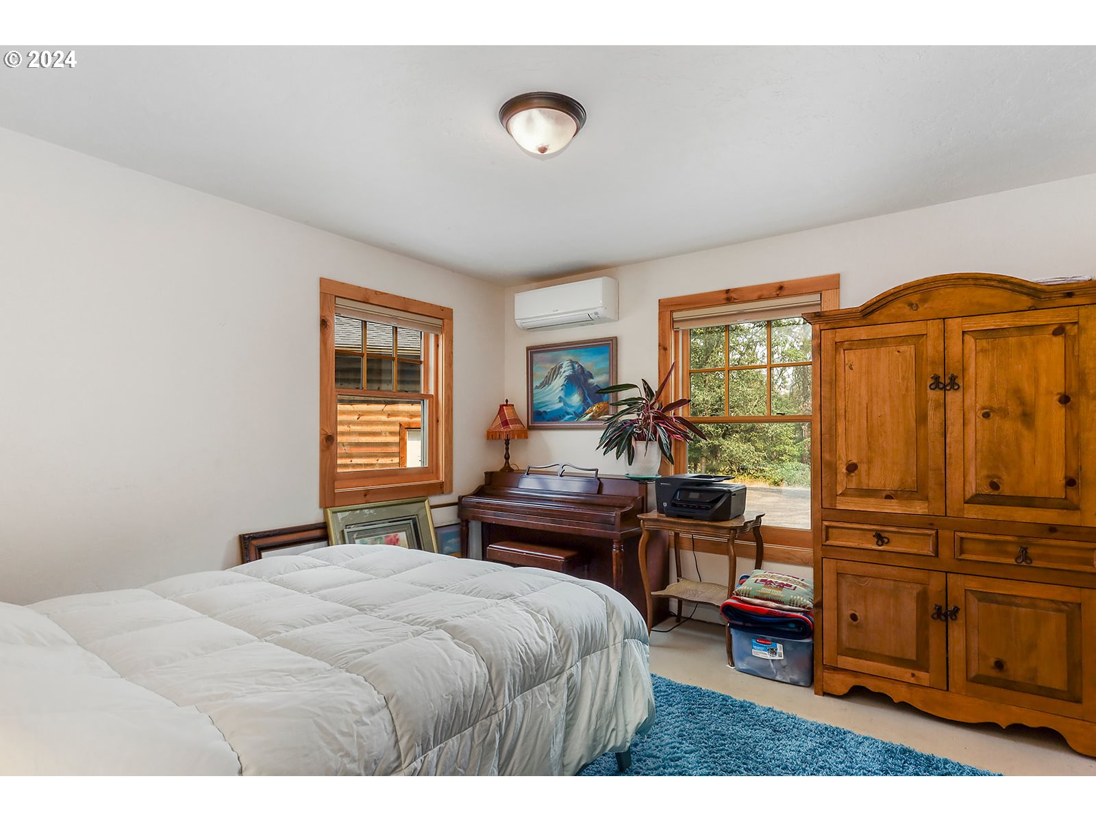3610 Benton Road Hood River, OR 97031 - Photo 24 of 48 a bedroom with a bed and wooden furniture
