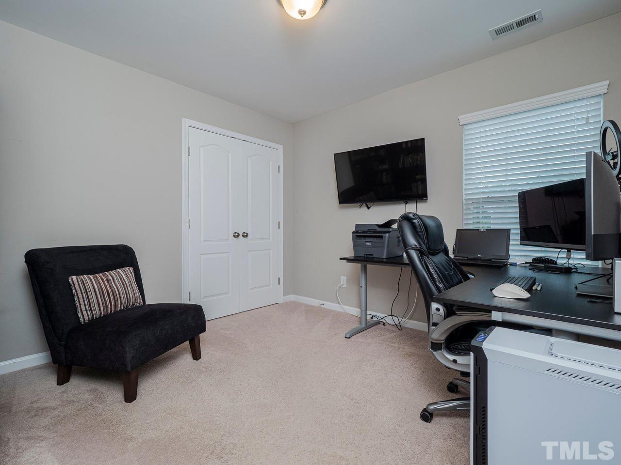 1001 Ileagnes Road Raleigh, NC 27603 - Photo 18 of 26 a view of a livingroom with workspace and a couch