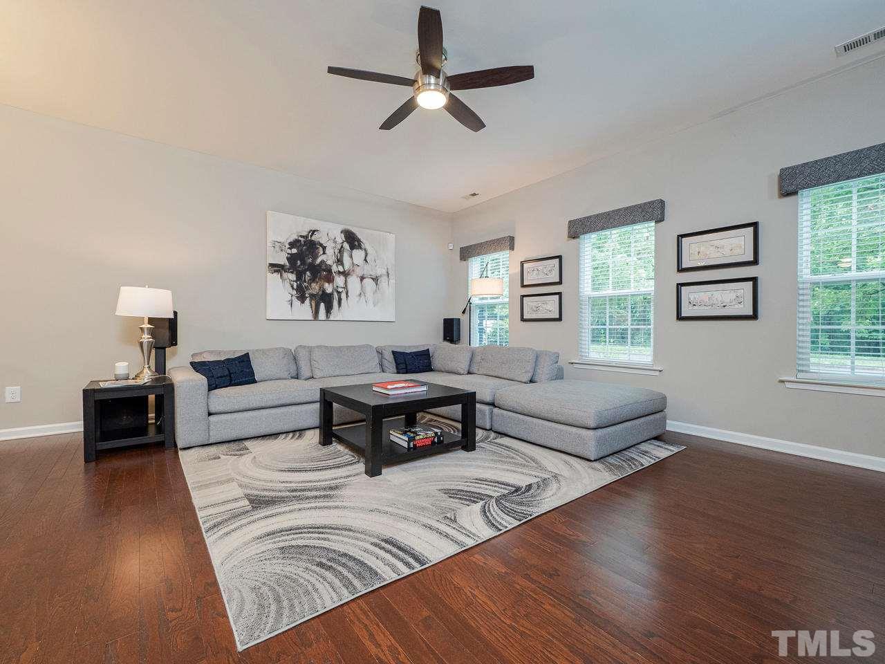 1001 Ileagnes Road Raleigh, NC 27603 - Photo 3 of 26 a living room with furniture and a wooden floor