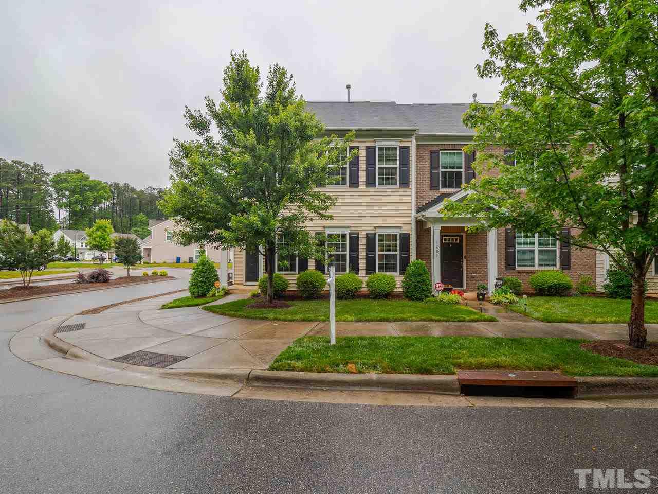 1001 Ileagnes Road Raleigh, NC 27603 - Photo 21 of 26 a view of a white house with a yard and road