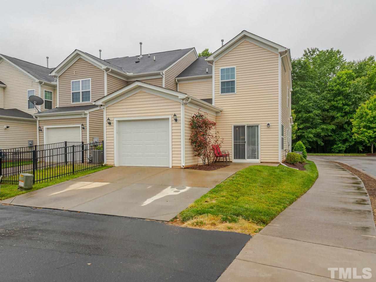 1001 Ileagnes Road Raleigh, NC 27603 - Photo 22 of 26 a front view of a house with a yard and garage