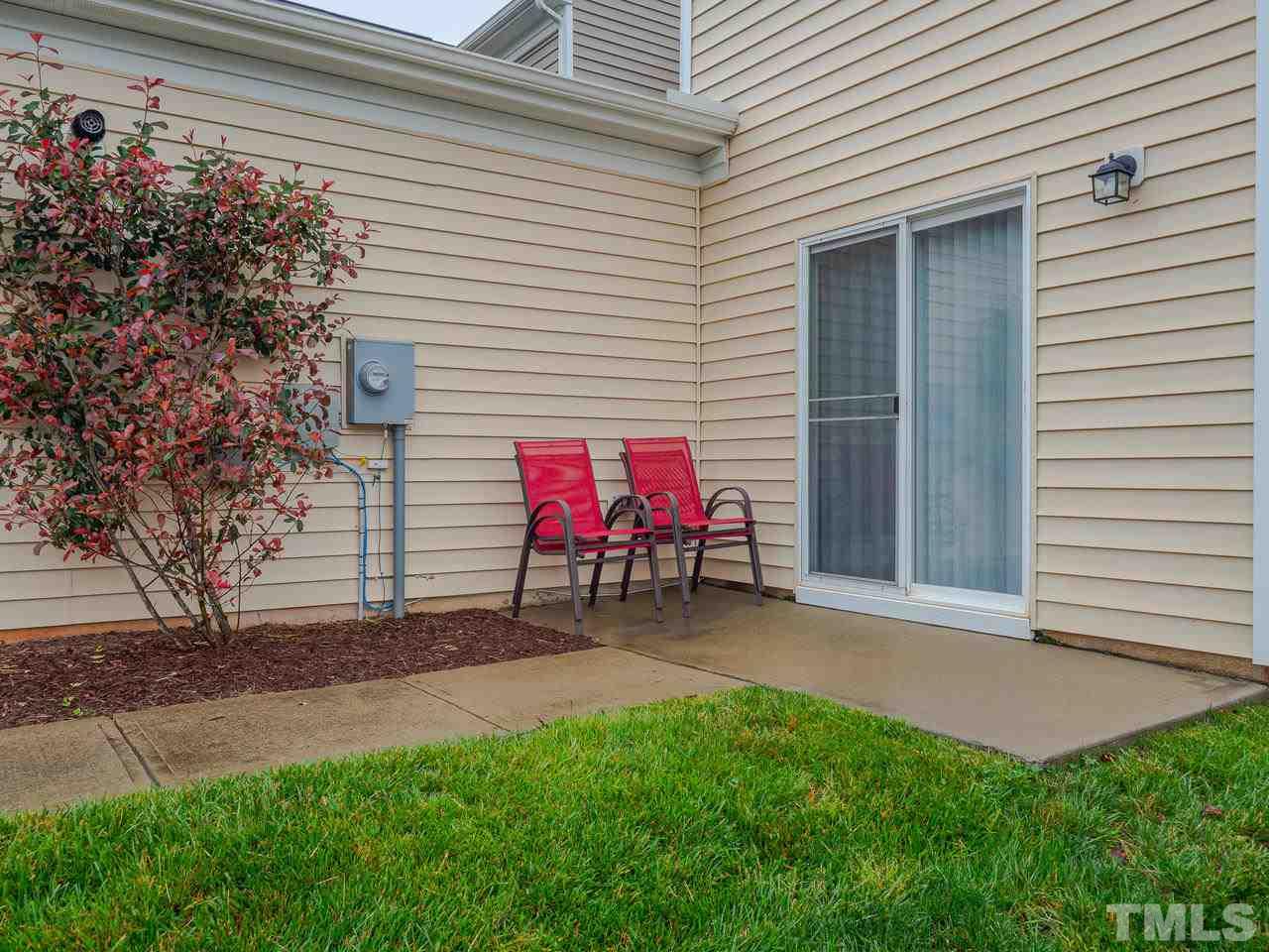 1001 Ileagnes Road Raleigh, NC 27603 - Photo 24 of 26 a view of a chair and table in backyard of the house