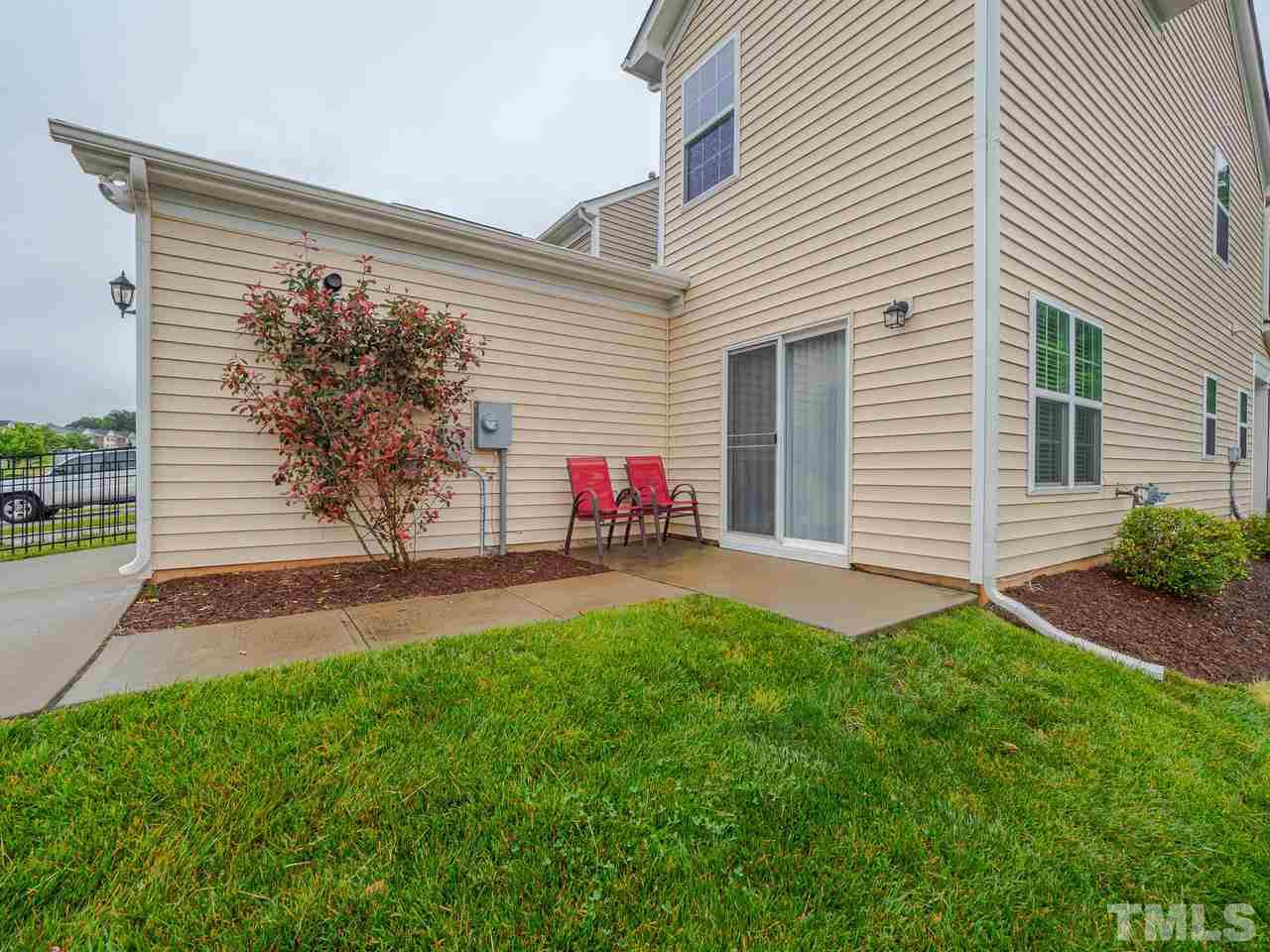 1001 Ileagnes Road Raleigh, NC 27603 - Photo 25 of 26 a view of backyard of house with green space