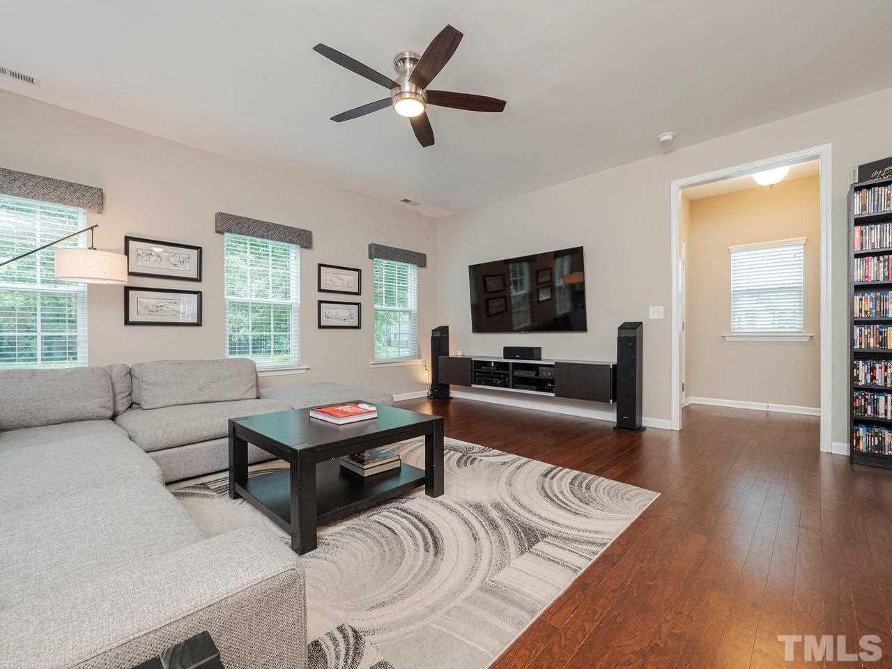1001 Ileagnes Road Raleigh, NC 27603 - Photo 4 of 26 a living room with furniture and a flat screen tv