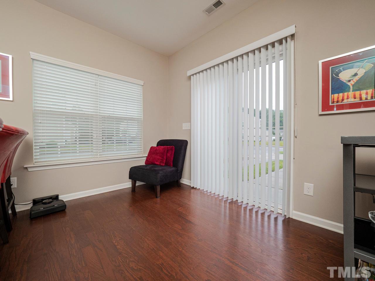 1001 Ileagnes Road Raleigh, NC 27603 - Photo 10 of 26 a living room with furniture and a wooden floor