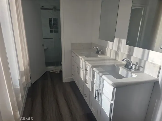 a kitchen with sink stove and cabinets