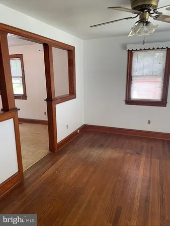 a view of an entryway with wooden floor