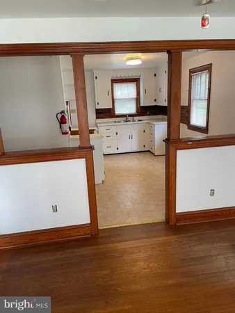 a view of a kitchen with wooden floor