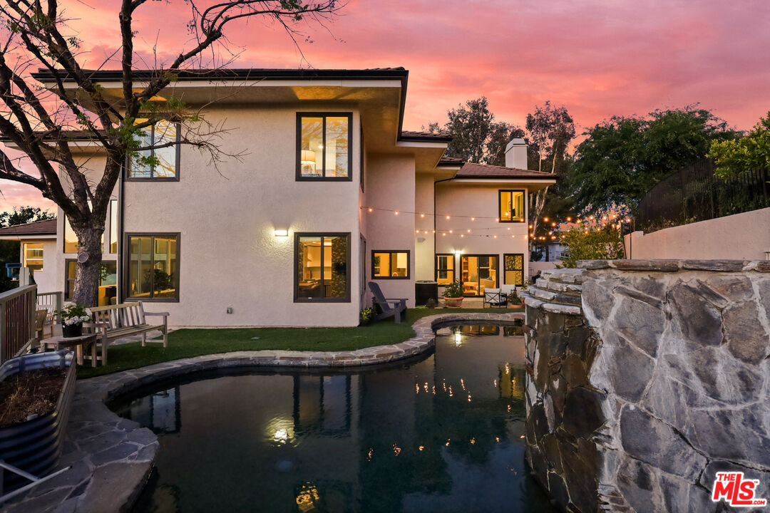53 Saddlebow Road Bell Canyon, CA 91307 - Photo 31 of 66 a front view of a house with swimming pool
