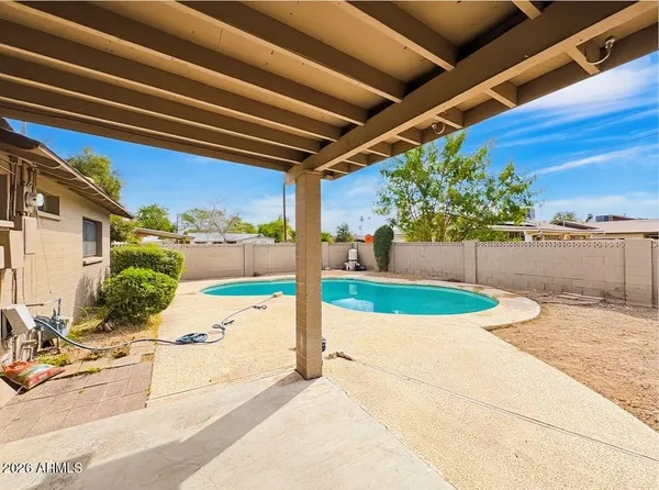 a view of a backyard of a house