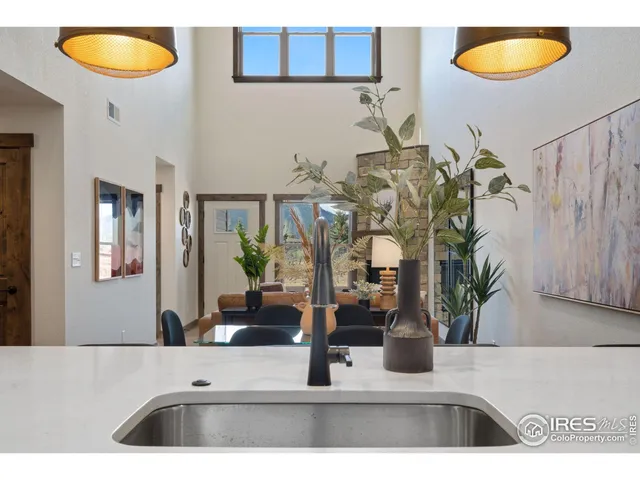 a view of an empty room and a ceiling fan