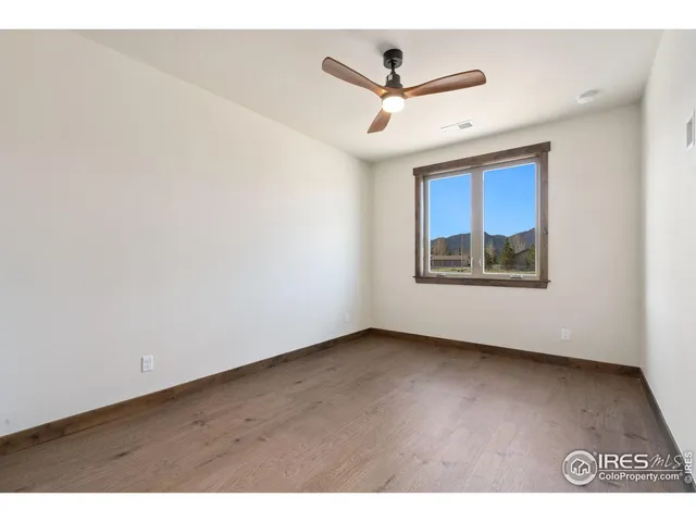 a bathroom with a double vanity sink mirror and toilet