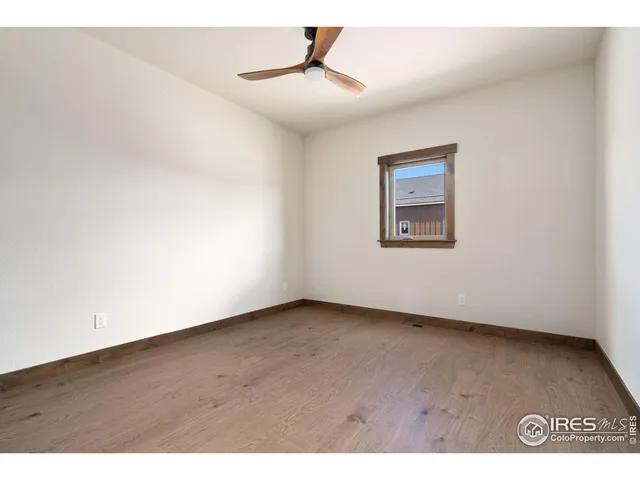 a front view of a building with a garden