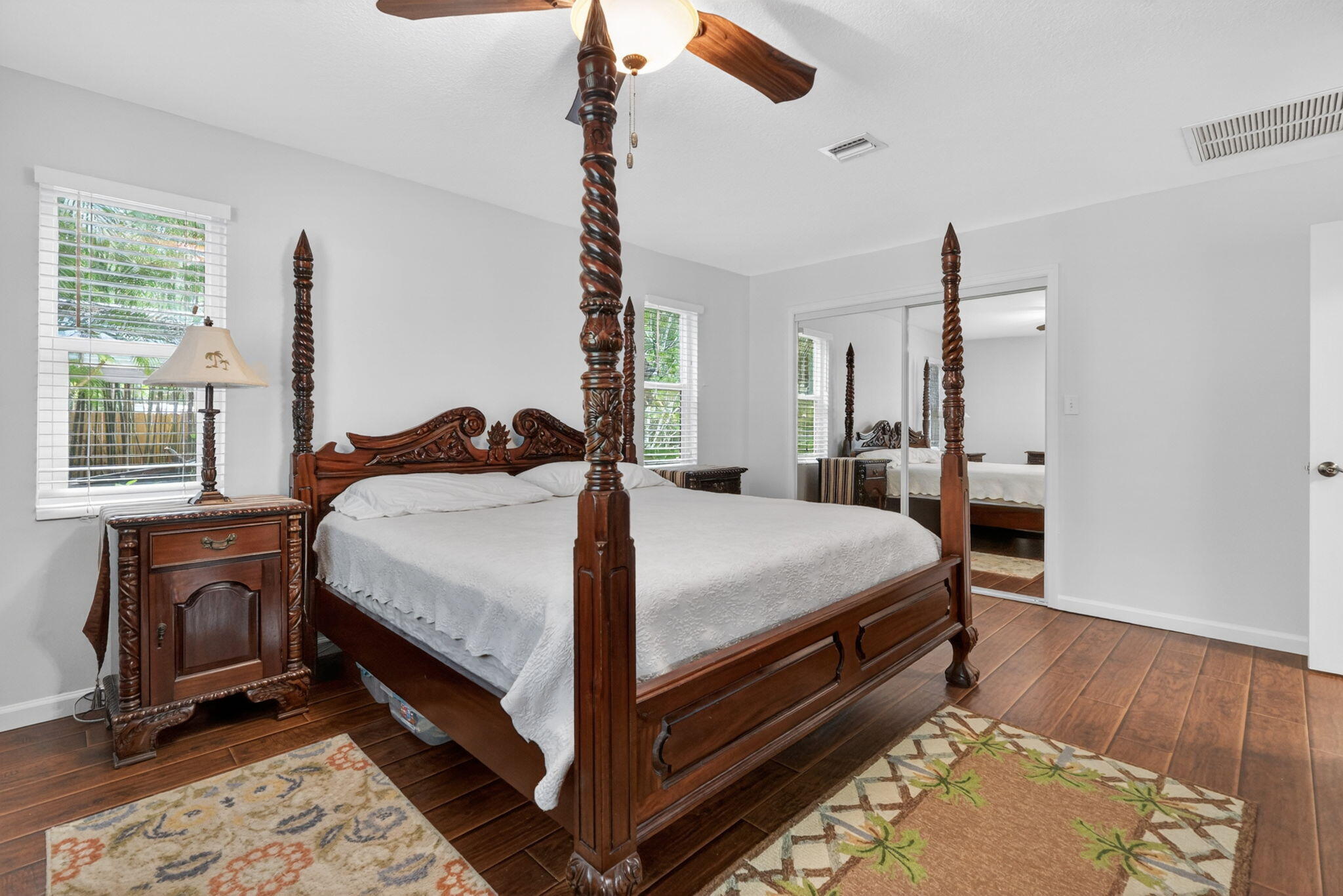 17391 Alexander Run Jupiter, FL 33478 - Photo 12 of 55 a bedroom with a bed and wooden floor