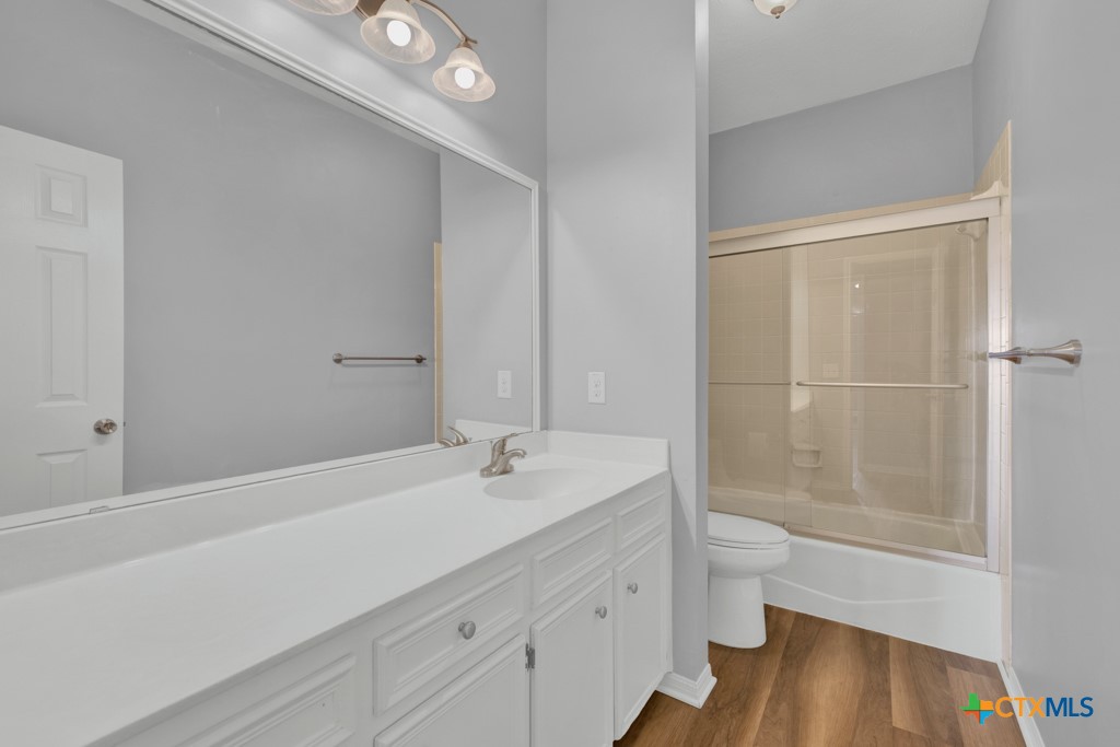 1013 Chestnut Street, Unit D San Marcos, TX 78666 - Photo 16 of 19 a bathroom with a sink a toilet and shower