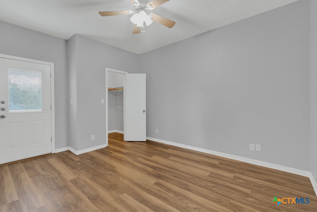 1013 Chestnut Street, Unit D San Marcos, TX 78666 - Photo 17 of 19 a view of an empty room with wooden floor