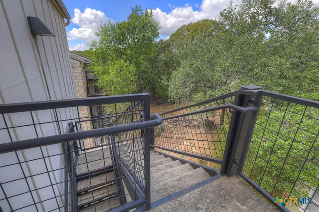 a view of a balcony with wooden floor