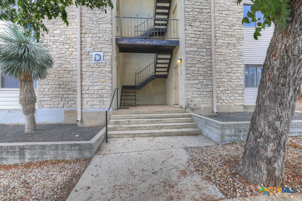1013 Chestnut Street, Unit D San Marcos, TX 78666 - Photo 2 of 19 a front view of a house with stairs