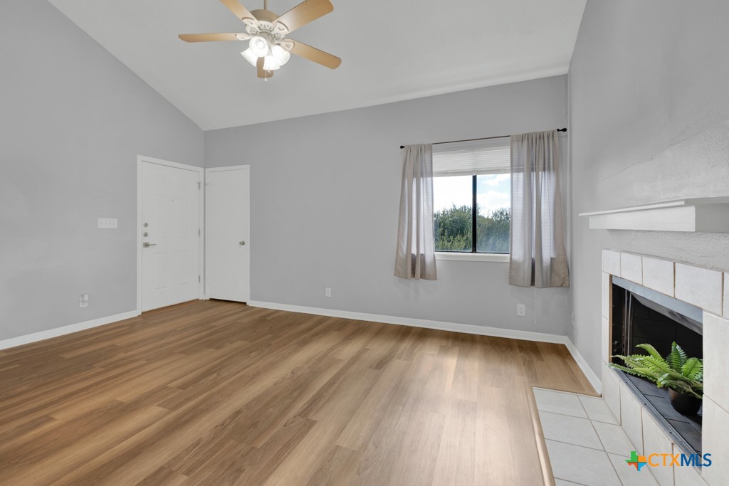1013 Chestnut Street, Unit D San Marcos, TX 78666 - Photo 4 of 19 wooden floor in an empty room with a window