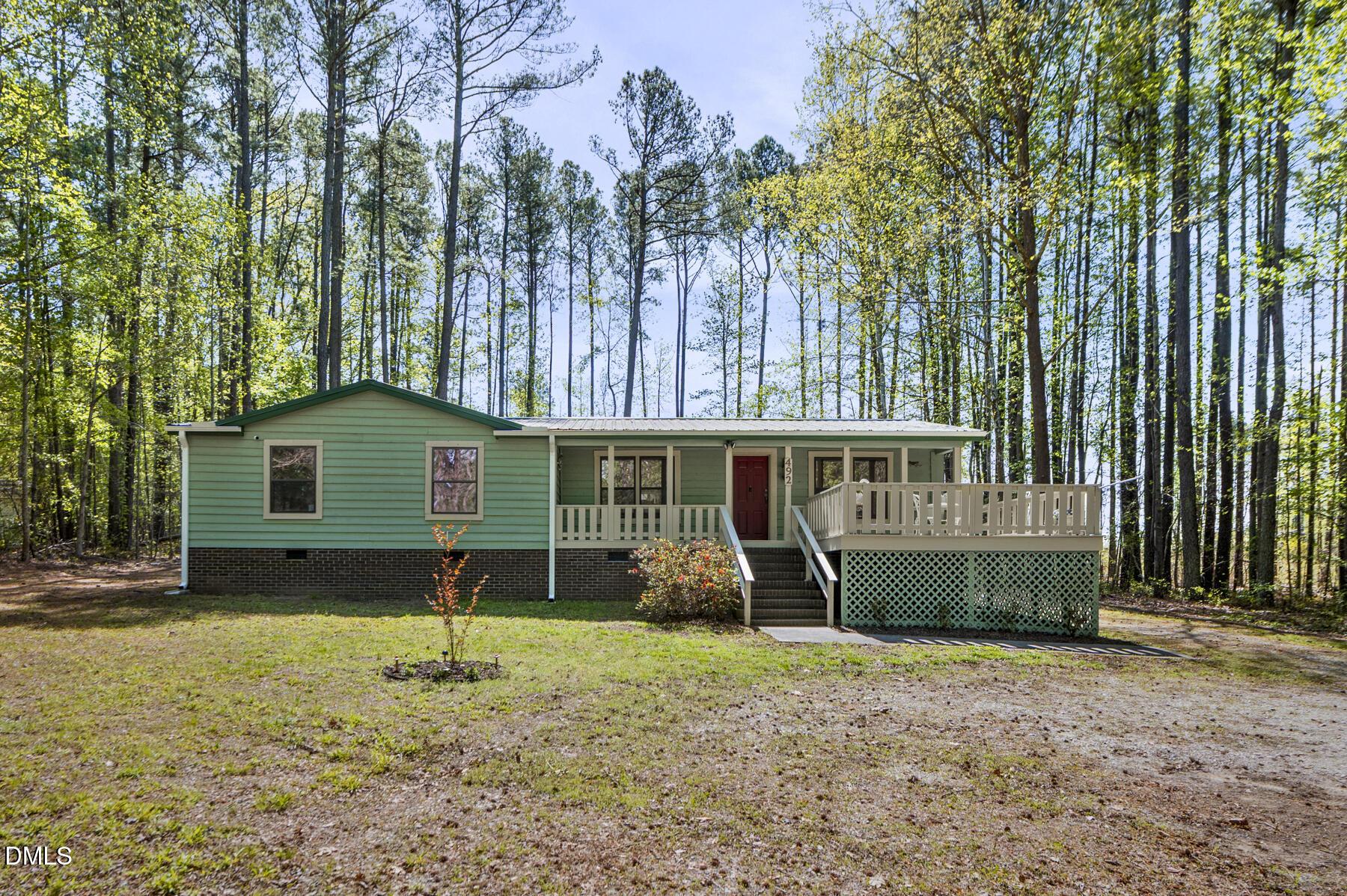492 Little Mill Road Henderson, NC 27537 - Photo 1 of 39 a front view of a house with a yard and garage