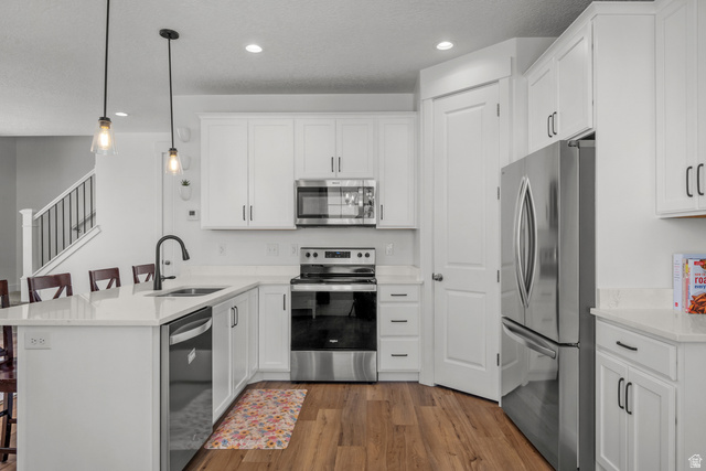 1693 North Center Point Lane Salem, UT 84653 - Photo 6 of 26 Bright kitchen featuring white shaker cabinetry, stainless steel appliances, and quartz countertops