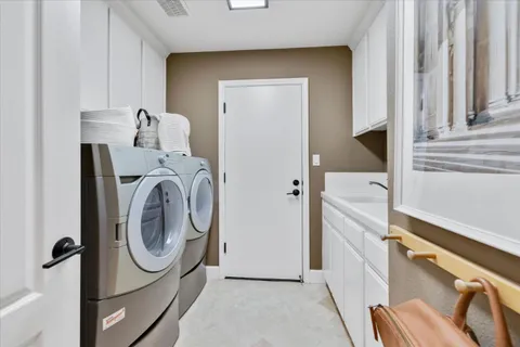 a view of a patio with table and chairs and potted plants