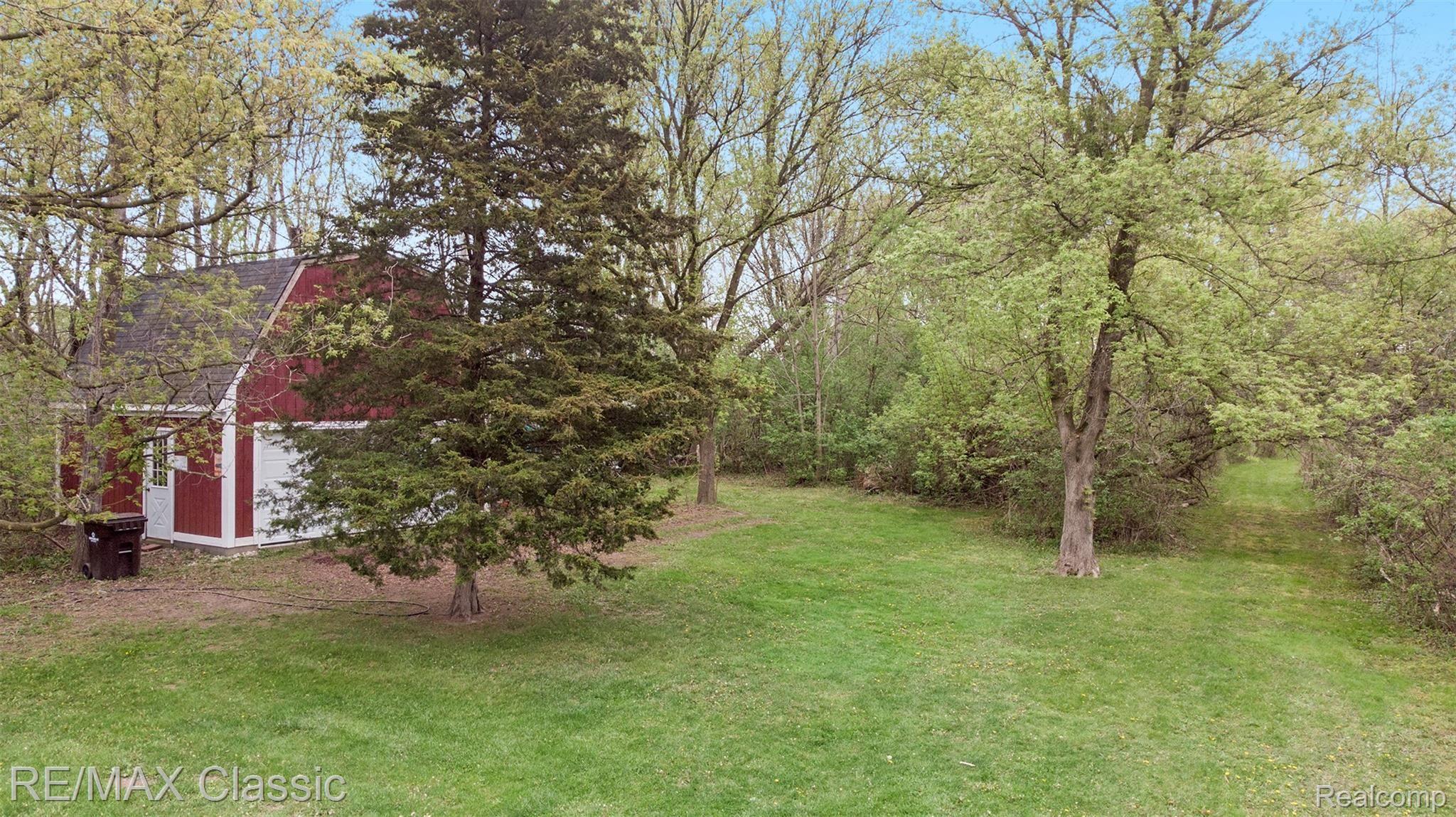 2800 Wixom Road Commerce Township, MI 48382 - Photo 9 of 38 To the right is a path to see the horses at the farm