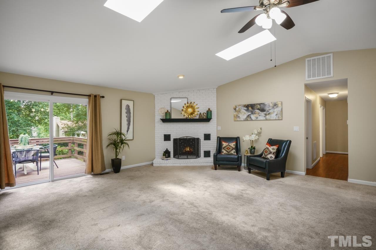 7016 Ray Road Raleigh, NC 27613 - Photo 7 of 26 a view of living room with furniture and a fireplace