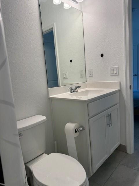 5133 Armina Place, Unit STUDIO Fort Pierce, FL 34951 - Photo 13 of 15 a bathroom with a sink a toilet and mirror