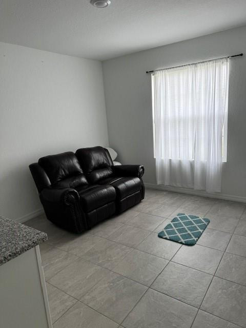 5133 Armina Place, Unit STUDIO Fort Pierce, FL 34951 - Photo 4 of 15 a living room with a couch and a stove top oven
