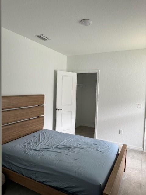 5133 Armina Place, Unit STUDIO Fort Pierce, FL 34951 - Photo 7 of 15 a bedroom with a bed and cabinet