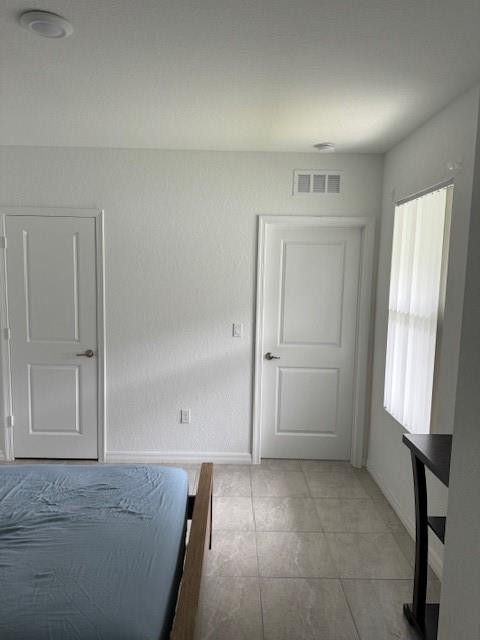 5133 Armina Place, Unit STUDIO Fort Pierce, FL 34951 - Photo 8 of 15 a view of empty room with windows and wardrobe