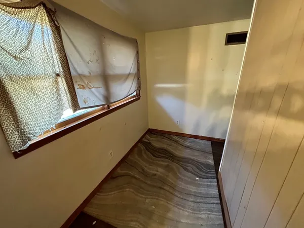 a view of balcony with wooden floor