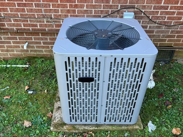 a view of a wooden door with a small yard