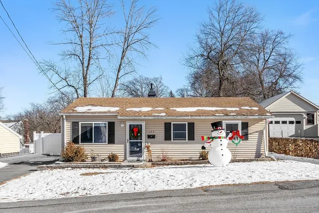 a front view of house with yard porch and furniture