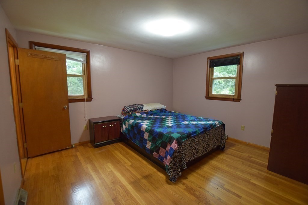 69 Deerfield Road Sharon, MA 02067 - Photo 6 of 12 a bed sitting in a spacious bedroom next to a window