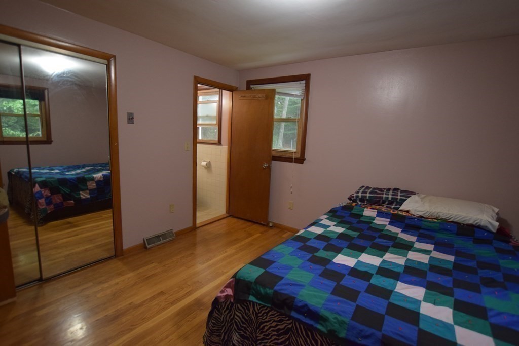 69 Deerfield Road Sharon, MA 02067 - Photo 7 of 12 a bedroom with a bed and a dresser