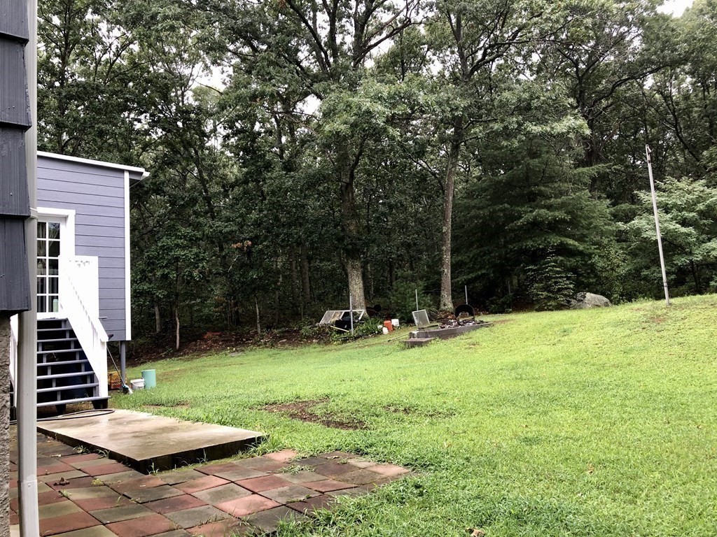 69 Deerfield Road Sharon, MA 02067 - Photo 10 of 12 a view of a backyard with sitting area and furniture