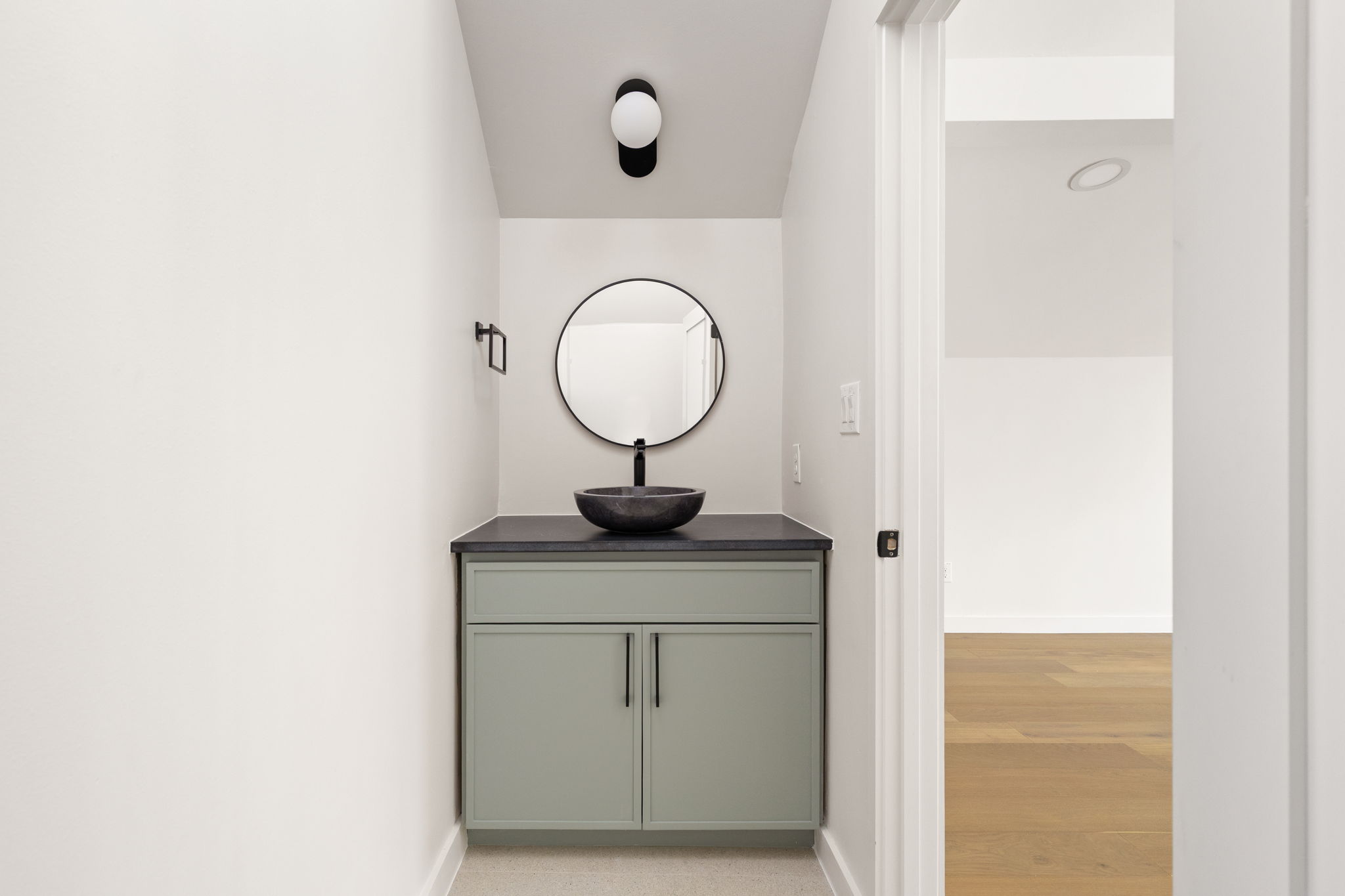 2717 Lyons Road, Unit 1 Austin, TX 78702 - Photo 31 of 40 A refined powder room with modern vanity and vessel sink offers understated elegance.